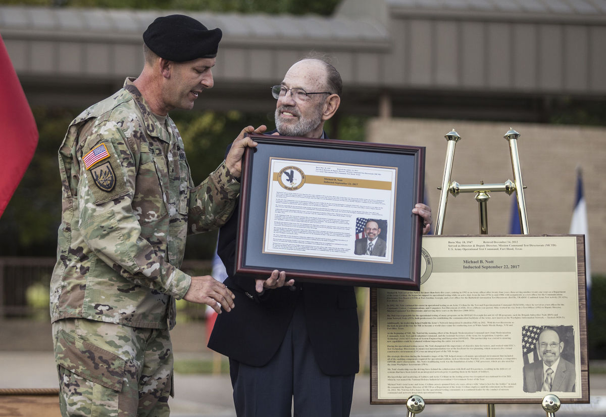 Brig. Gen. John Ulrich, left, inducts Michael B. Nott into the U.S. Army Operational Testers' Hall of Fame Friday during the 24th Annual Induction Ceremony on Fort Hood. (Photo Credit: Eric J. Shelton | Herald)