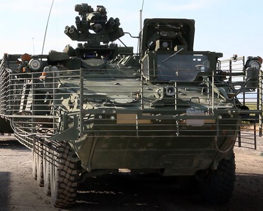 The Army's Stryker Nuclear, Biological, Chemical, Reconnaissance Vehicle awaits the start of the Joint Chemical Agent Detector system Stryker-On-The-Move test at Target S Grid at Dugway Proving Ground, July 2017. The JCAD will be integrated with the Stryker vehicle as a replacement for the Automatic Chemical Agent Detection Alarm, which will no longer be manufactured for and fielded by the Army. Photo captured from video by Darrell L. Gray, Dugway Proving Ground Public Affairs. (Photo Credit: U.S. Army)