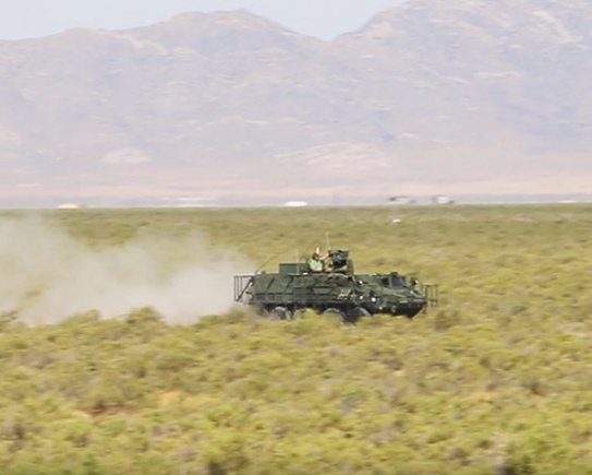 An instrumented Stryker Nuclear, Biological, Chemical, Reconnaissance Vehicle speeds down the grid trail during Joint Chemical Agent Detector system Stryker On-The-Move tests at Target S Grid at Dugway Proving Ground, July 2017. Dugway's data gathering capabilities, large area, and technical expertise made it the perfect location for the system tests. Photo captured from video by Darrell L. Gray, Dugway Proving Ground Public Affairs. (Photo Credit: U.S. Army)