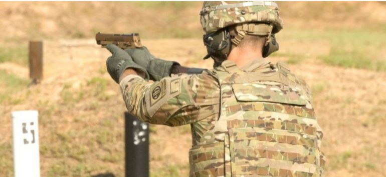 A service member fires the Sig Sauer P320 during Modular Handgun System tests for the U.S. Army Operational Test Command, conducted at Fort Bragg, N.C. Aug. 27. (Photo Credit: U.S. Army photo by Lewis Perkins)