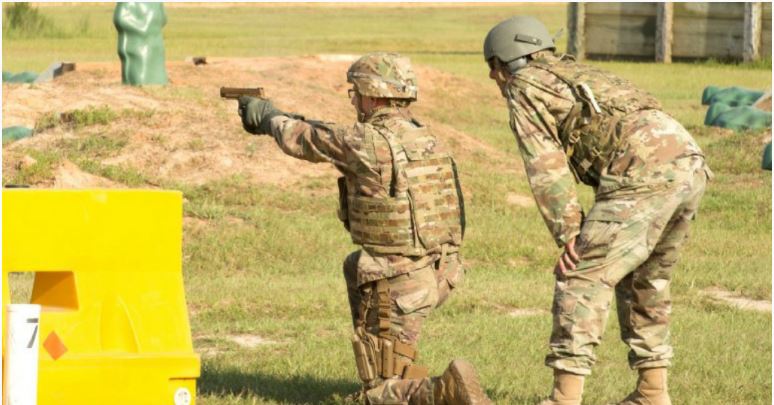 A service member fires the Sig Sauer P320 during Modular Handgun System tests for the U.S. Army Operational Test Command, conducted at Fort Bragg, N.C. Aug. 27. (Photo Credit: U.S. Army photo by Lewis Perkins)