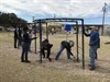 Soldiers and Army Civilians with U.S. Army Operational Test Command paint monkey bars on "Make A Difference Day" at the Florence ISD Elementary School playground. (Photo Credit: Mr. Michael M Novogradac (Hood))
