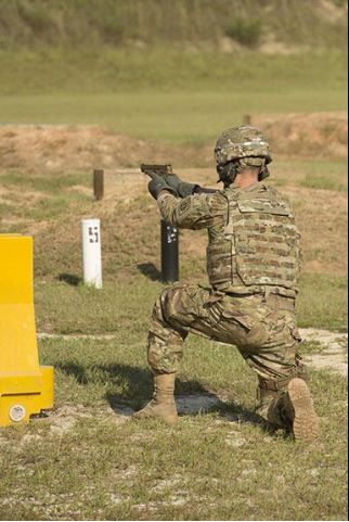 A service member fires the Sig Sauer P320 during a Modular Handgun System test for the U.S. Army Operational Test Command, conducted at Fort Bragg, Aug. 27. (Photo by Lewis Perkins/Paraglide)