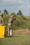 A service member fires the Sig Sauer P320 during a Modular Handgun System test for the U.S. Army Operational Test Command, conducted at Fort Bragg, Aug. 27. (Photo by Lewis Perkins/Paraglide)