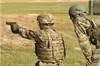 A service member fires the Sig Sauer P320 during a Modular Handgun System test for the U.S. Army Operational Test Command, conducted at Fort Bragg, Aug. 27. (Photo by Lewis Perkins/Paraglide)