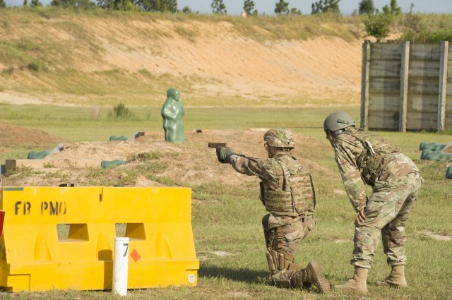 A service member fires the Sig Sauer P320 during Modular Handgun System tests for the U.S. Army Operational Test Command, conducted at Fort Bragg, N.C. Aug. 27. (Photo Credit: U.S. Army photo by Lewis Perkins)