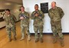 From left to right, Staff Sgt. Luis Aguilar, Sgt. 1st Class Jay Alan Ottinger, Sgt. 1st Class Benito Santos, and Sgt. 1st Class Ryan Neal, all research development test and evaluation (RDT&E) non-commissioned officers with Operational Test Command's Maneuver Test Directorate (MTD), stand ready to teach flag etiquette to students at Florence Elementary School, Florence Texas, on Jan. 20, 2017. (Photo Credit: Mr. Michael M Novogradac (Hood))