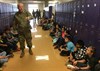 Sgt. 1st Class Ryan Neal, a research development test and evaluation non-commissioned officer in Operational Test Command's Maneuver Test Directorate, fields a question during flag etiquette training at Florence Elementary School, Florence Texas, on Jan. 20, 2017. (Photo Credit: Mr. Michael M Novogradac (Hood))