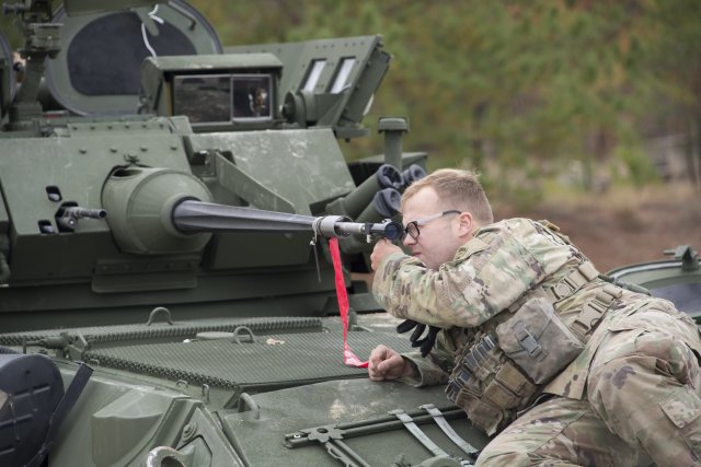 Army Spc. Michael Taylor, Gunner, B Company, 5th Squadron 73rd Cavalry Regiment, 3rd Brigade Combat Team bore sights the LAV-25A2 post-airdrop. (Photo Credit: Jim Finney, Audio Visual Specialist, Airborne and Special Operations Directorate, U.S. Army Operational Test Command)